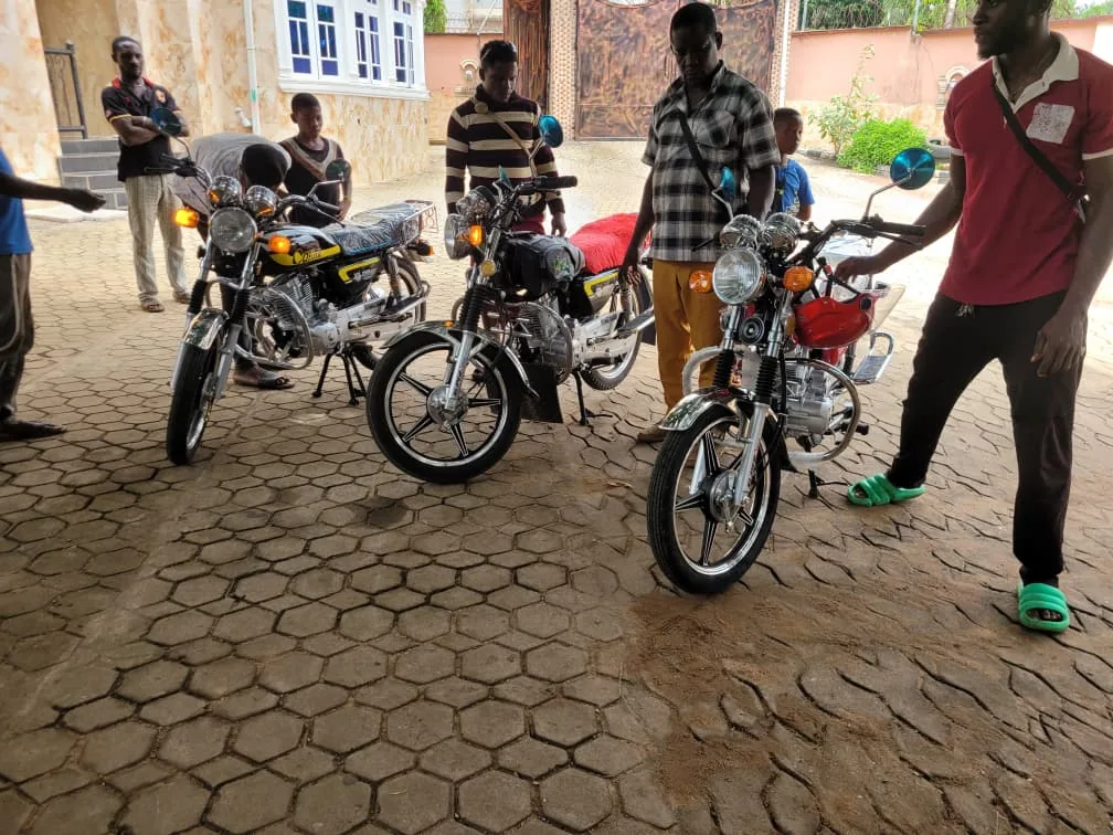 Motorcycles and community participants during Holyghost Anointed Foundation empowerment activity