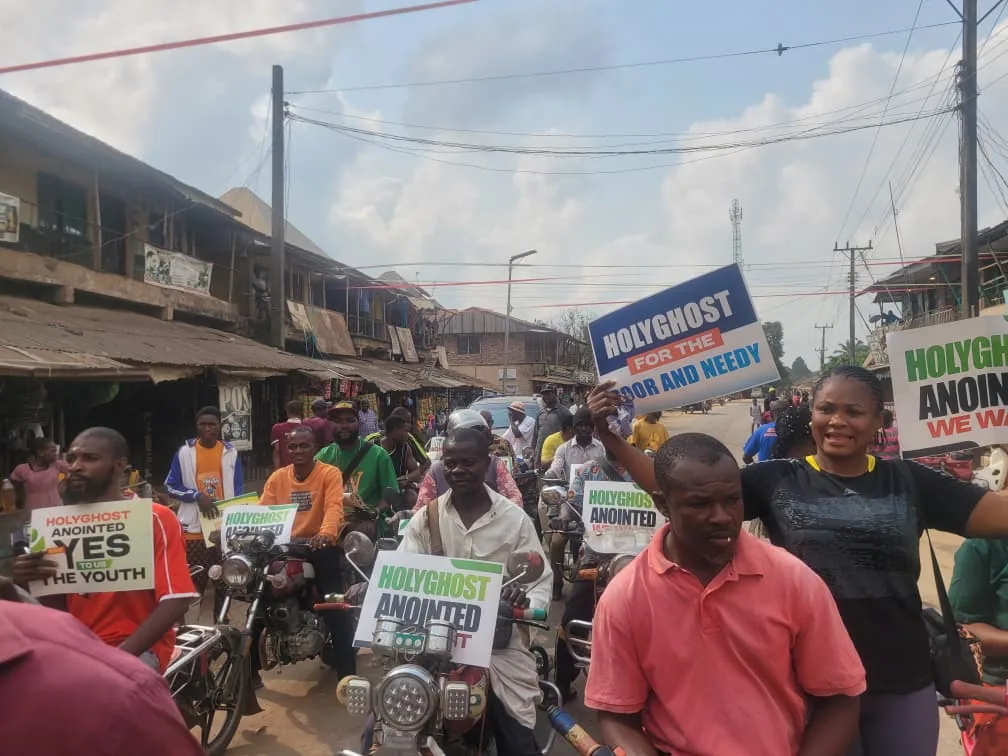 Riders and community members during Holyghost Anointed Foundation outreach